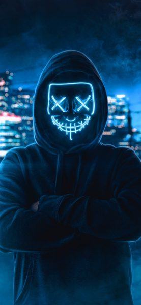 một hình ảnh của một hacker với mặt nạ neon